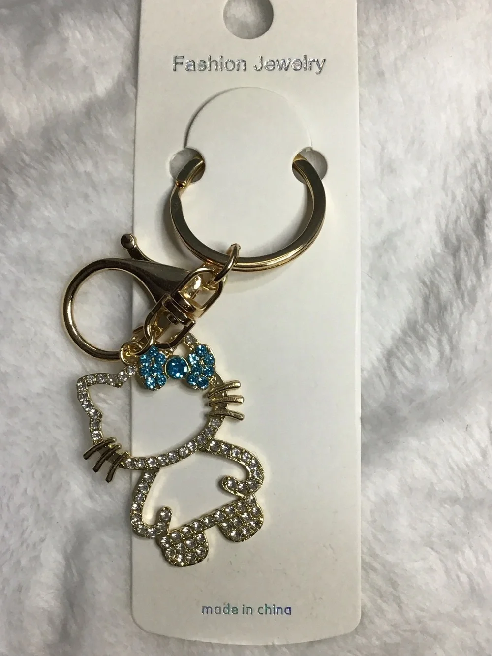 Gold-tone Crystal Cat Keychain with Blue Bow